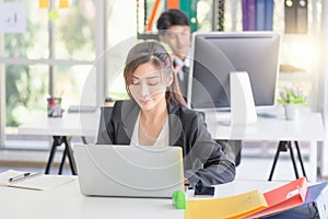 Business woman working at the office, Two young business colleagues in modern office