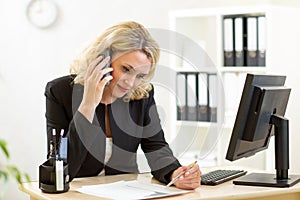 Business woman working in office. Worker talking