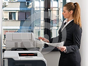 Business woman working on printer