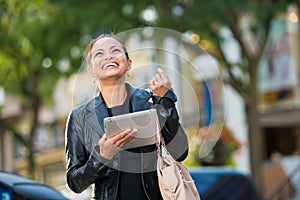 Business woman working on tablet pc photo