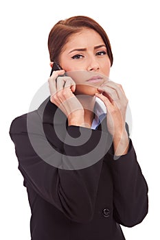 Business woman worries onthe phone