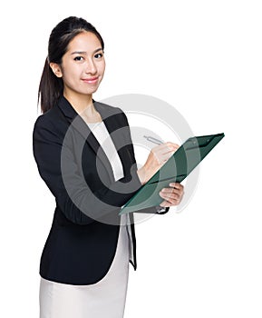Business woman write down on clipboard