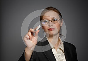 Business woman writing with chalk