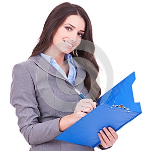 Business woman writing on clipboard