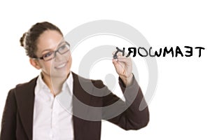 Business woman writing on transparent board