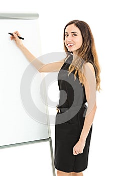 Business woman writing on a white board