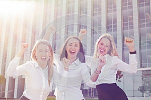 Business women celebrating their success