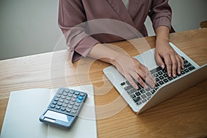 Business women checking  bills. taxes bank account balance and calculating  annual financial statements of company. Accounting