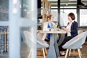 Business women during a coffee time in the cafe