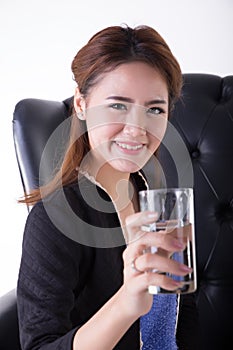 Business women drinking in a chair