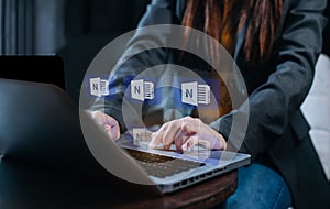 Business women hand working with laptop computer and tablet with documents on office desk in modern office