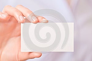 Business women handing a business card