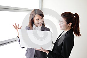 Business women look and smile conversation