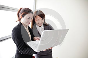 Business women look and smile conversation