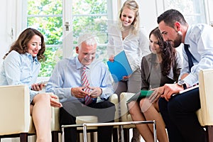 Business women and men having presentation in office