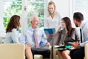 Business women and men having presentation in office