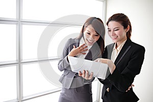 Business women smile conversation