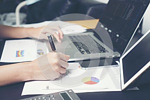 Business women working at her office desk with documents and laptop. Businesswoman working on work.