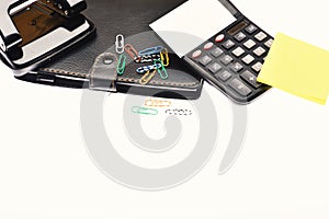 Calculator and stationery with copy space, close up