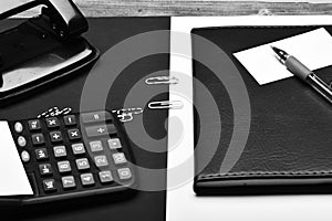 Business and work concept. Office tools on black and white background, close up