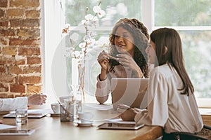 Business young caucasian woman in modern office with team