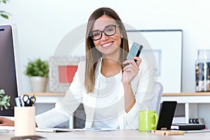 Business young woman using credit card on online shop.