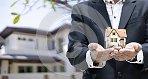 Businesses on buying - selling homes, businessmen with models