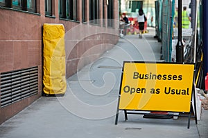 Businesses open as usual sign