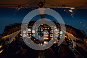 Businessjet Cockpit at night during cruise flight.