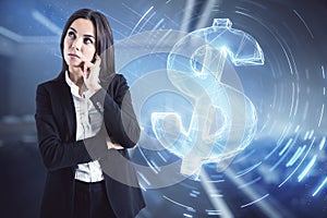 Businesslady in a black suit thinking with a dollar sign in the background. Investment and money management concept