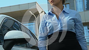 Businesslady getting out of car dropping phone and throwing papers, hateful work