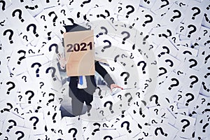 Businessman with 2021 number on cardboard head