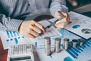 Businessman accountant counting money and making notes at report doing finances and calculate about cost of investment and