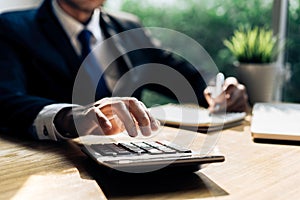 Businessman accouting management with calculator