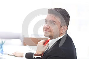 Businessman Adjust Necktie his Suit