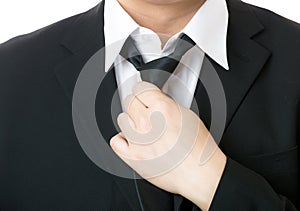 Businessman adjust tie