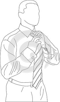 Businessman adjusting tie