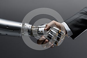 Businessman and AI Artificial Intelligence robot handshake. Business relationship, partnership and teamwork concept.