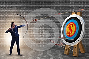 Businessman aiming arrow with bow