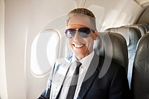 Businessman in airplane.