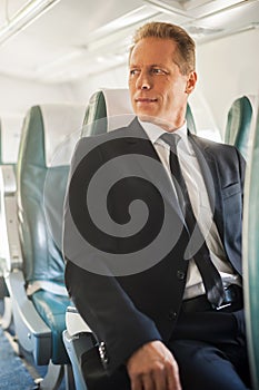 Businessman in airplane.