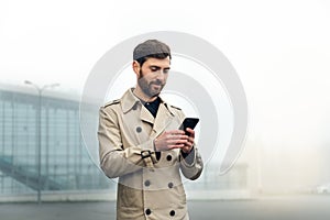 Businessman at the airport checking the flight