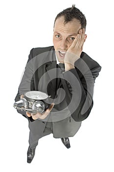 Businessman with alarm clock