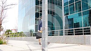 Businessman with amputee leg talking to the mobile while commuting