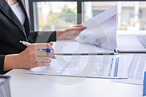 Businessman analysis comparing financial reports photo