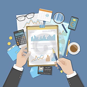 Businessman analyzes documents on clipboard. Auditing, accounting, analysis, analytics. Hands, calculator calendar folder money photo