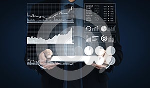 Businessman Analyzing Financial Data with Interactive Graphs and Charts in Modern Digital Interface Impute
