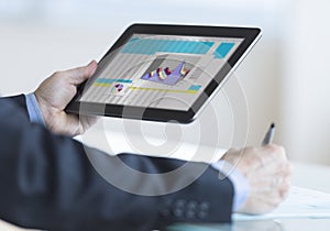 Businessman Analyzing Graph On Digital Tablet