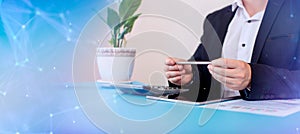 Businessman analyzing investment charts with laptop in office. panoramic banner