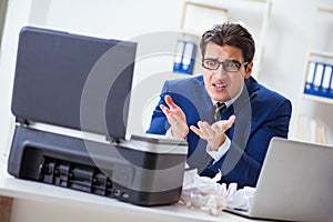 The businessman angry at copying machine jamming papers
